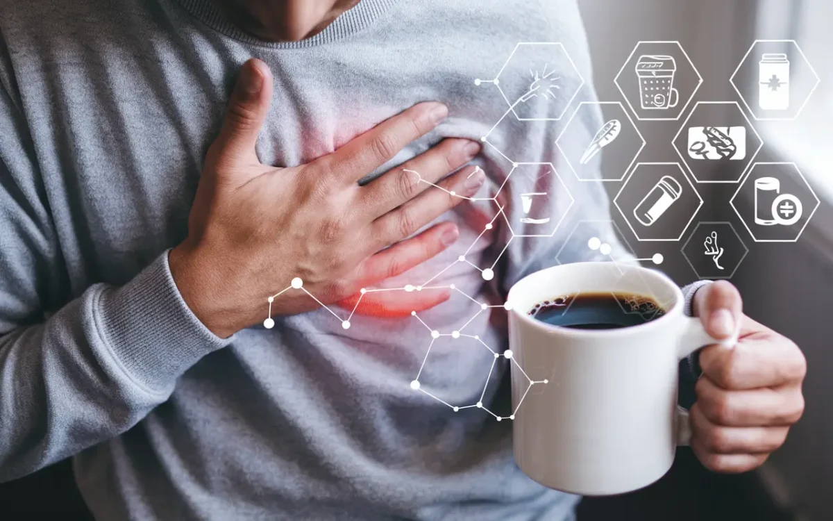 Person with chest pain and coffee mug