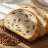 low FODMAP diet bread on wooden board with rice flour