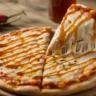 Hot Honey Magnifico Pizza close-up with spicy honey drizzle