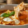 Slow Cooker Chicken Lasagna Soup creamy close-up with noodles and cheese pull